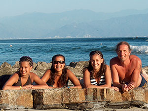 Sharon, Henry, Atisha and Jahnaya on the beach in Mexico